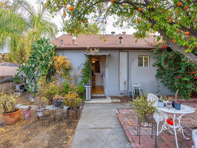 back of property with a patio area