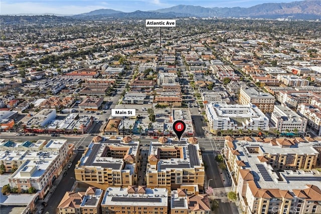 birds eye view of property with a mountain view