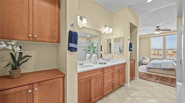 bathroom with ceiling fan, vanity, and tile patterned floors