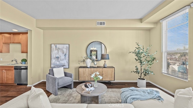 living room with sink and dark hardwood / wood-style floors