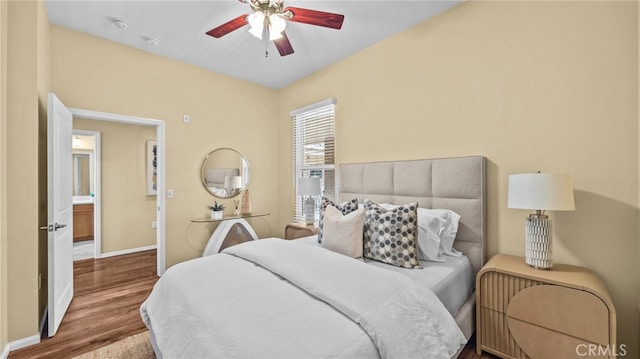 bedroom with hardwood / wood-style flooring and ceiling fan