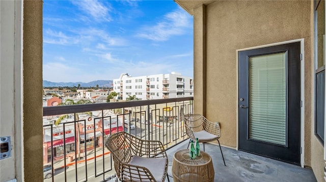 balcony featuring a mountain view