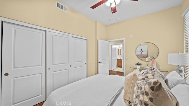 bedroom featuring ceiling fan and a closet