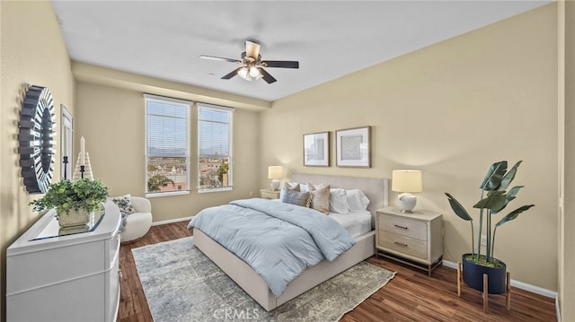 bedroom with ceiling fan and dark hardwood / wood-style flooring