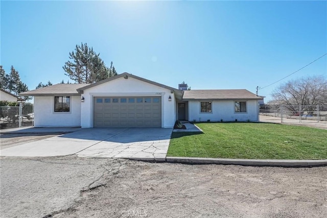 view of front of home with a garage and a front lawn