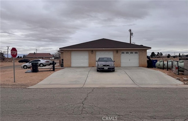 single story home with a garage