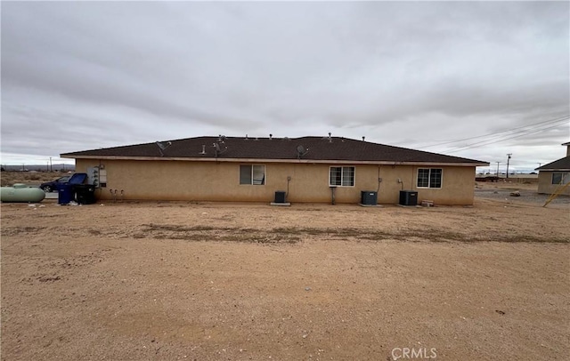 back of property with central AC unit