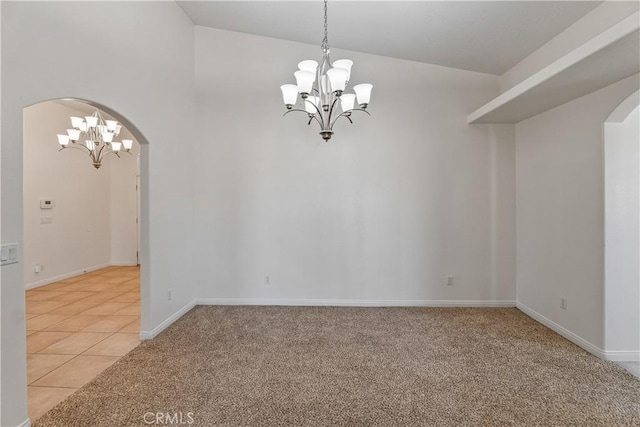 unfurnished room with an inviting chandelier, lofted ceiling, and light carpet