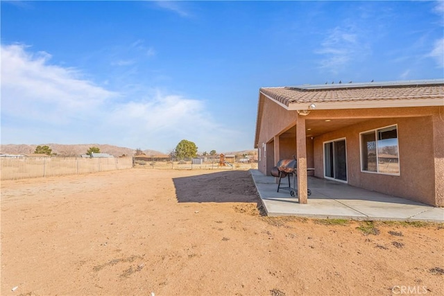 exterior space featuring a patio area and a rural view