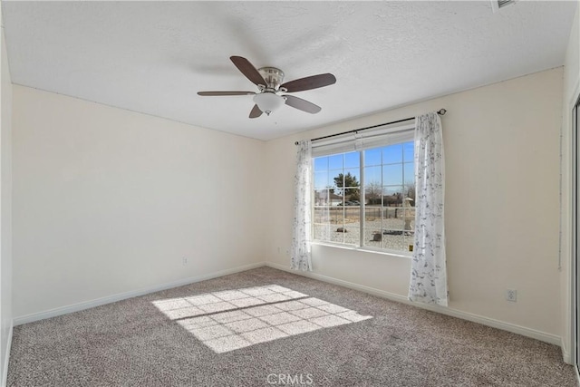 unfurnished room featuring ceiling fan, carpet flooring, and a textured ceiling