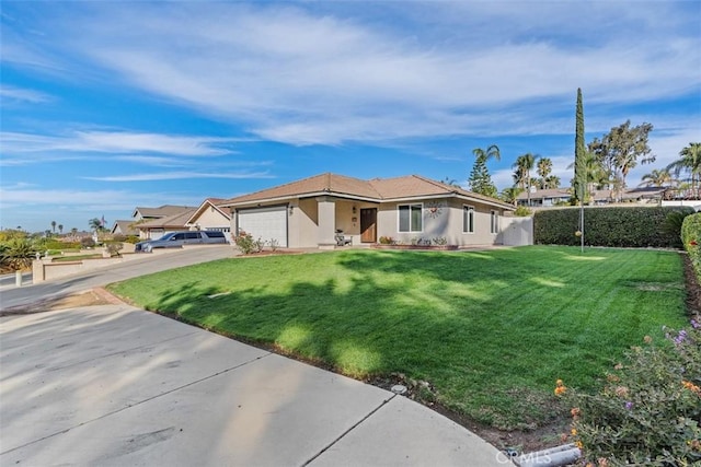 ranch-style house featuring a garage and a front yard