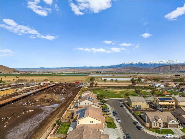 birds eye view of property featuring a mountain view and a residential view