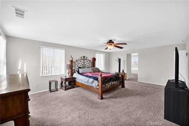 bedroom with visible vents, carpet floors, a ceiling fan, and baseboards