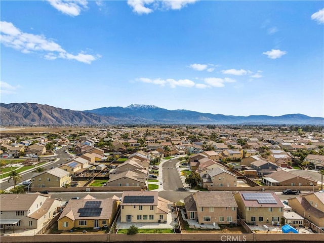 drone / aerial view featuring a residential view and a mountain view