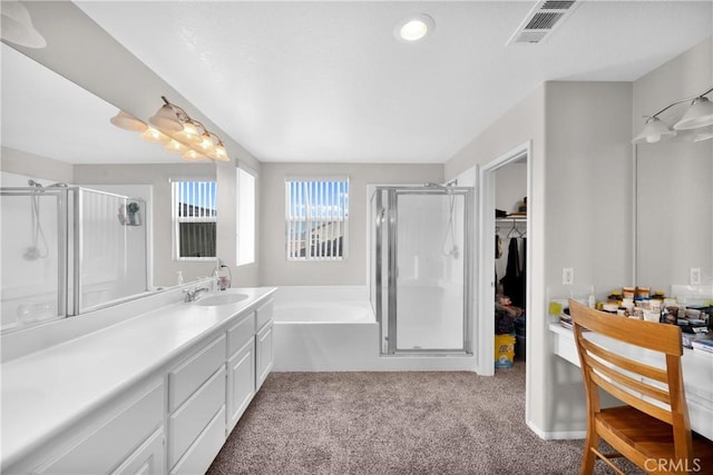 bathroom with carpet flooring, a shower stall, visible vents, and a walk in closet