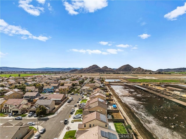 drone / aerial view with a residential view and a mountain view