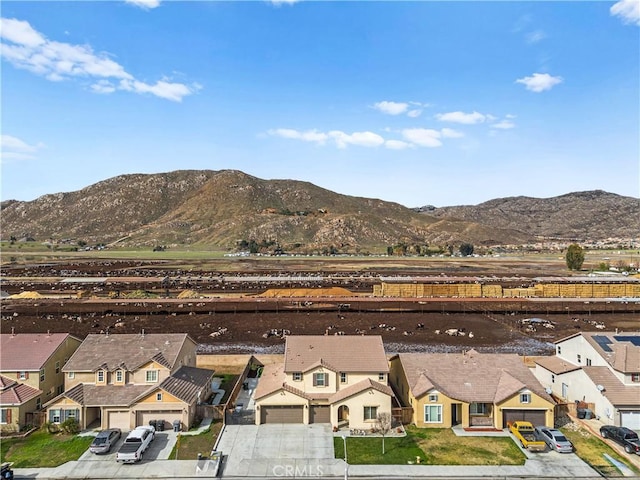 drone / aerial view featuring a mountain view and a residential view