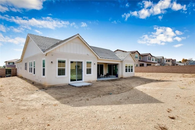 back of house with a patio