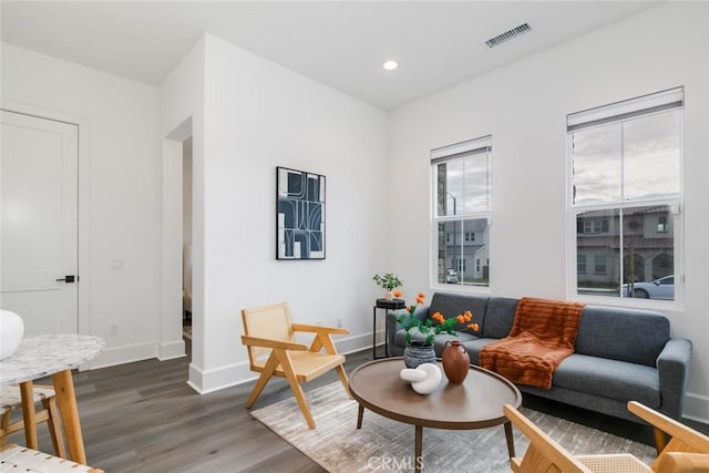 living room with dark hardwood / wood-style floors