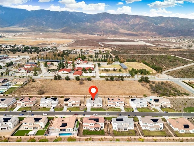 drone / aerial view featuring a mountain view