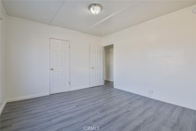 spare room featuring hardwood / wood-style flooring