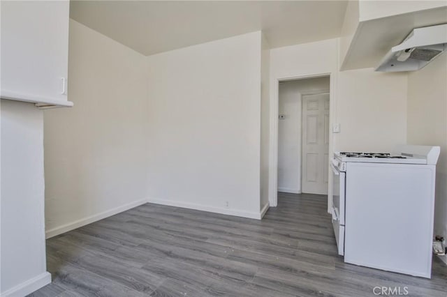 kitchen featuring wood-type flooring, white gas range, and white cabinets