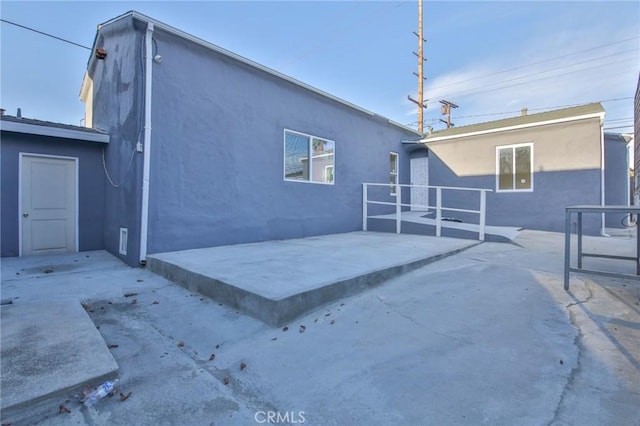 back of property featuring a patio area