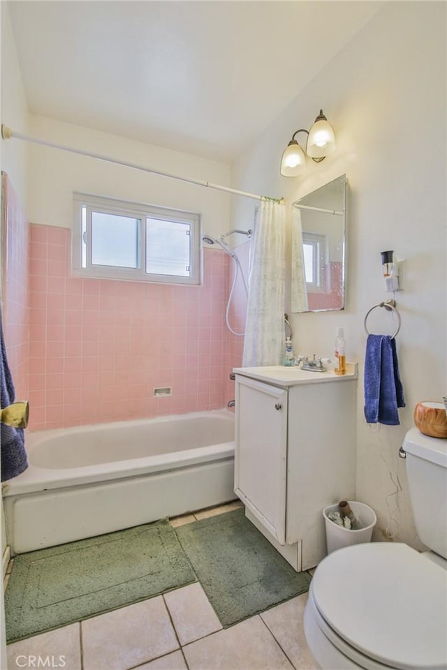 full bathroom with vanity, shower / tub combo with curtain, tile patterned floors, and toilet