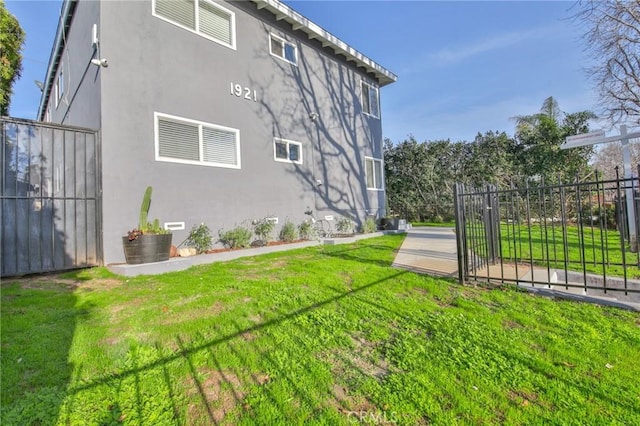 view of home's exterior featuring a yard