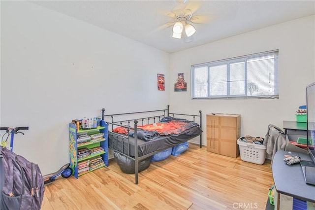 bedroom featuring ceiling fan and wood-type flooring