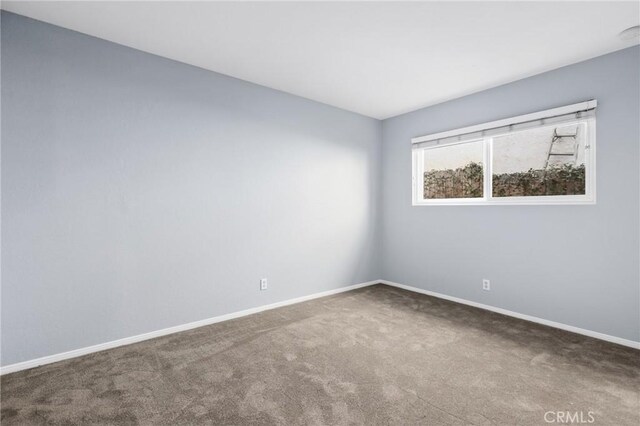 empty room with carpet flooring