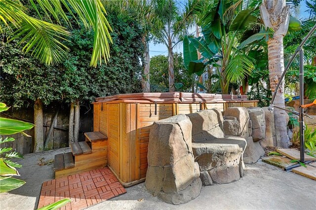 view of patio with a hot tub