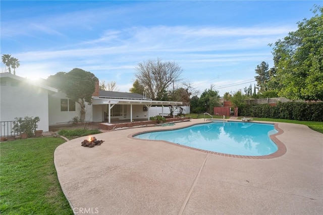 view of pool with a yard and a patio area