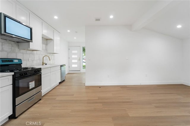 kitchen with white cabinetry, light hardwood / wood-style flooring, stainless steel dishwasher, range with gas stovetop, and decorative backsplash