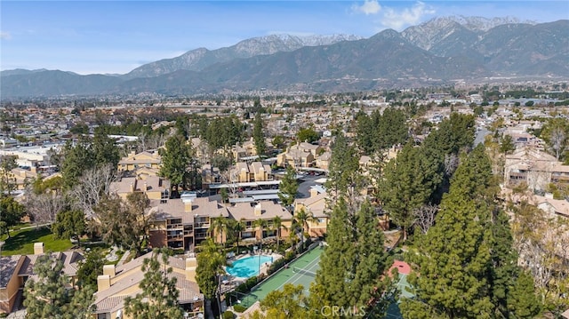 10655 Lemon Ave Unit 3706, Rancho Cucamonga, CA 91737 - aerial view of property and surrounding area featuring mountains, nearby suburban area, and a pool area