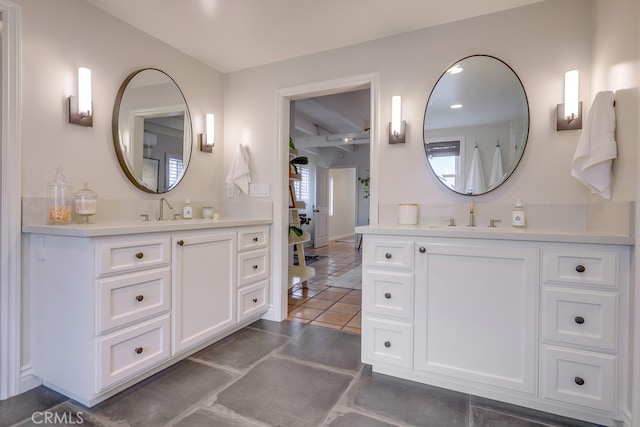 bathroom with vanity and tile patterned flooring