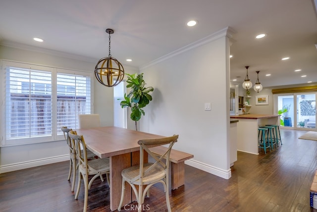 dining area featuring ornamental molding, dark hardwood / wood-style floors, and a wealth of natural light