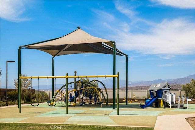 community playground featuring a mountain view