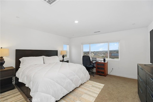 bedroom featuring recessed lighting, visible vents, baseboards, and light colored carpet