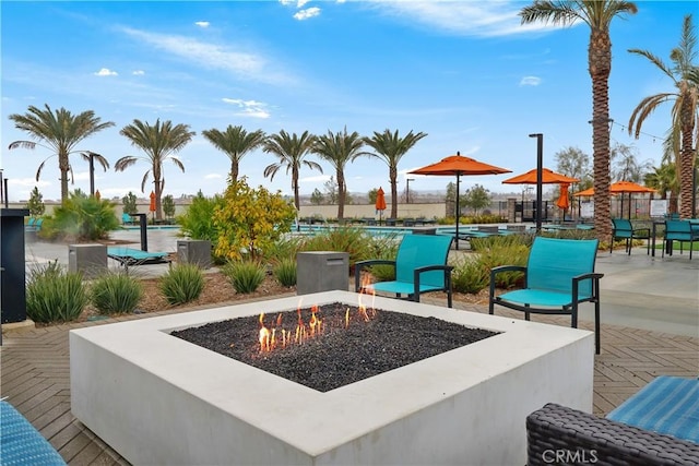 view of patio / terrace featuring an outdoor fire pit