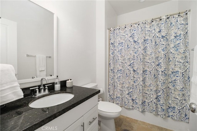 bathroom with shower / bath combination with curtain, toilet, and vanity