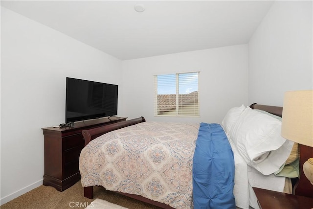 carpeted bedroom with baseboards