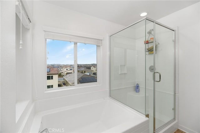 full bathroom with recessed lighting, a stall shower, and a garden tub