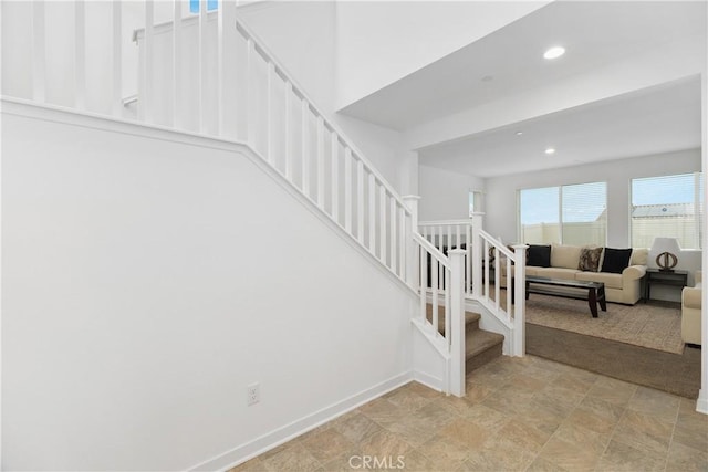 stairway featuring recessed lighting and baseboards