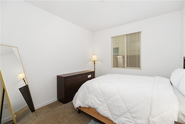 carpeted bedroom with baseboards