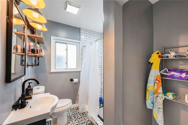 bathroom featuring tile patterned floors, toilet, vanity, and a shower with curtain