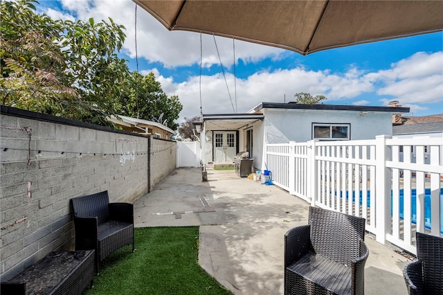 view of patio with a swimming pool