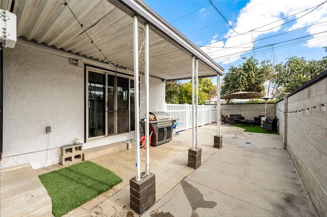 view of patio with a grill