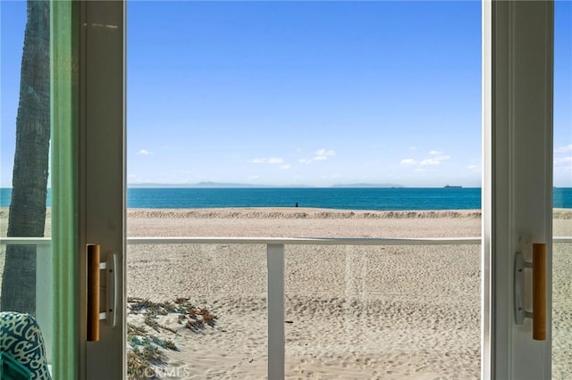 property view of water featuring a beach view