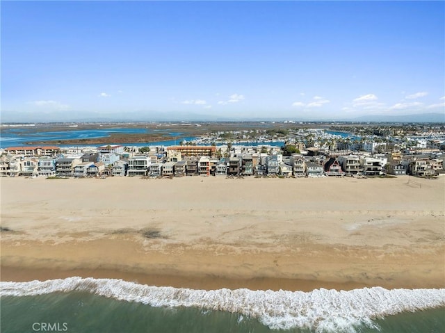 bird's eye view with a view of the beach and a water view